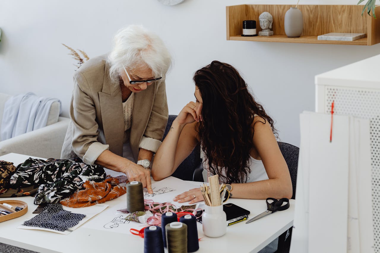 Professional tailoring workspace with fabrics and tools